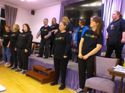 The AllSorted choir sang at the merger event